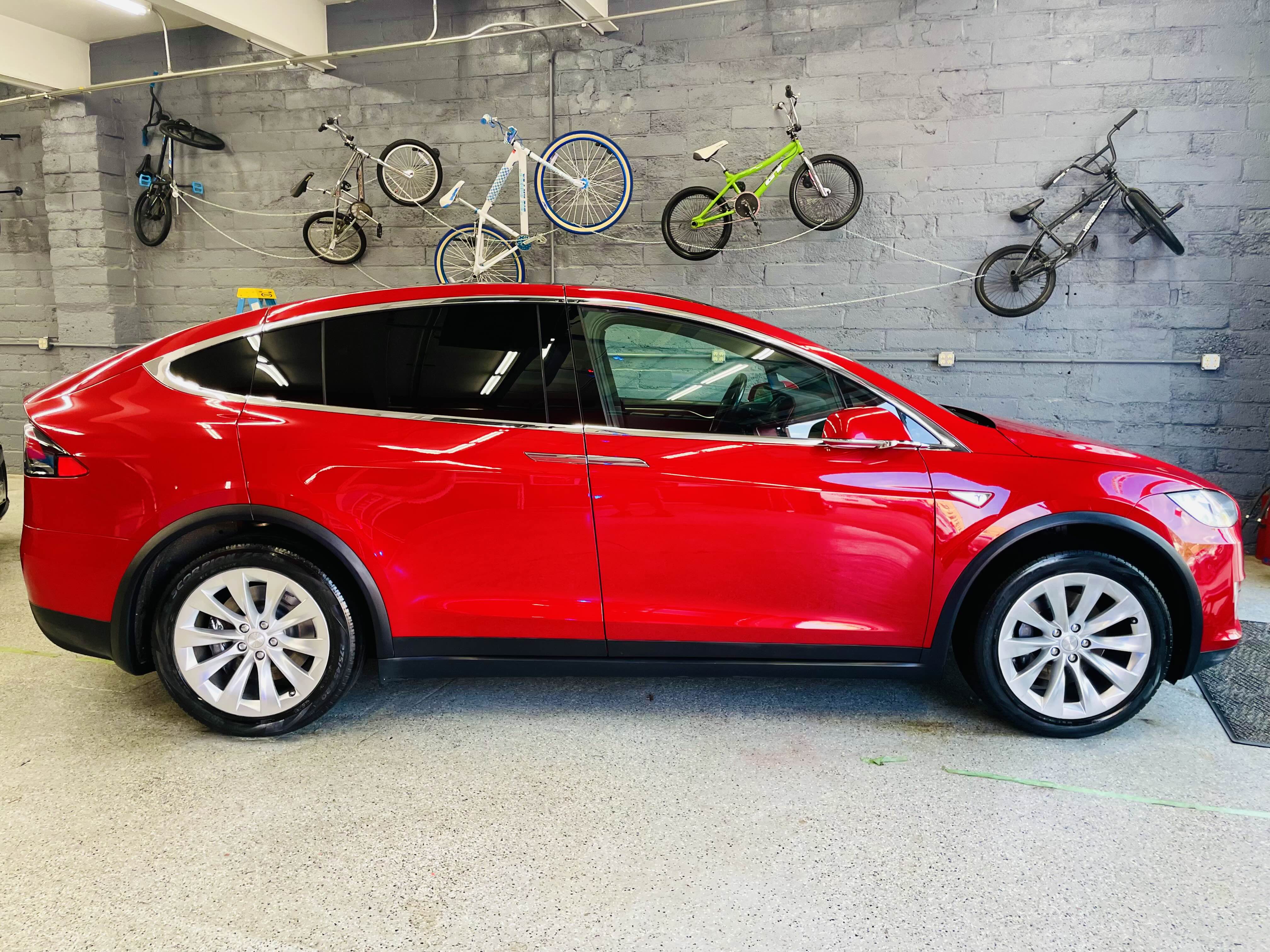 Detailed Red Tesla in Garage
