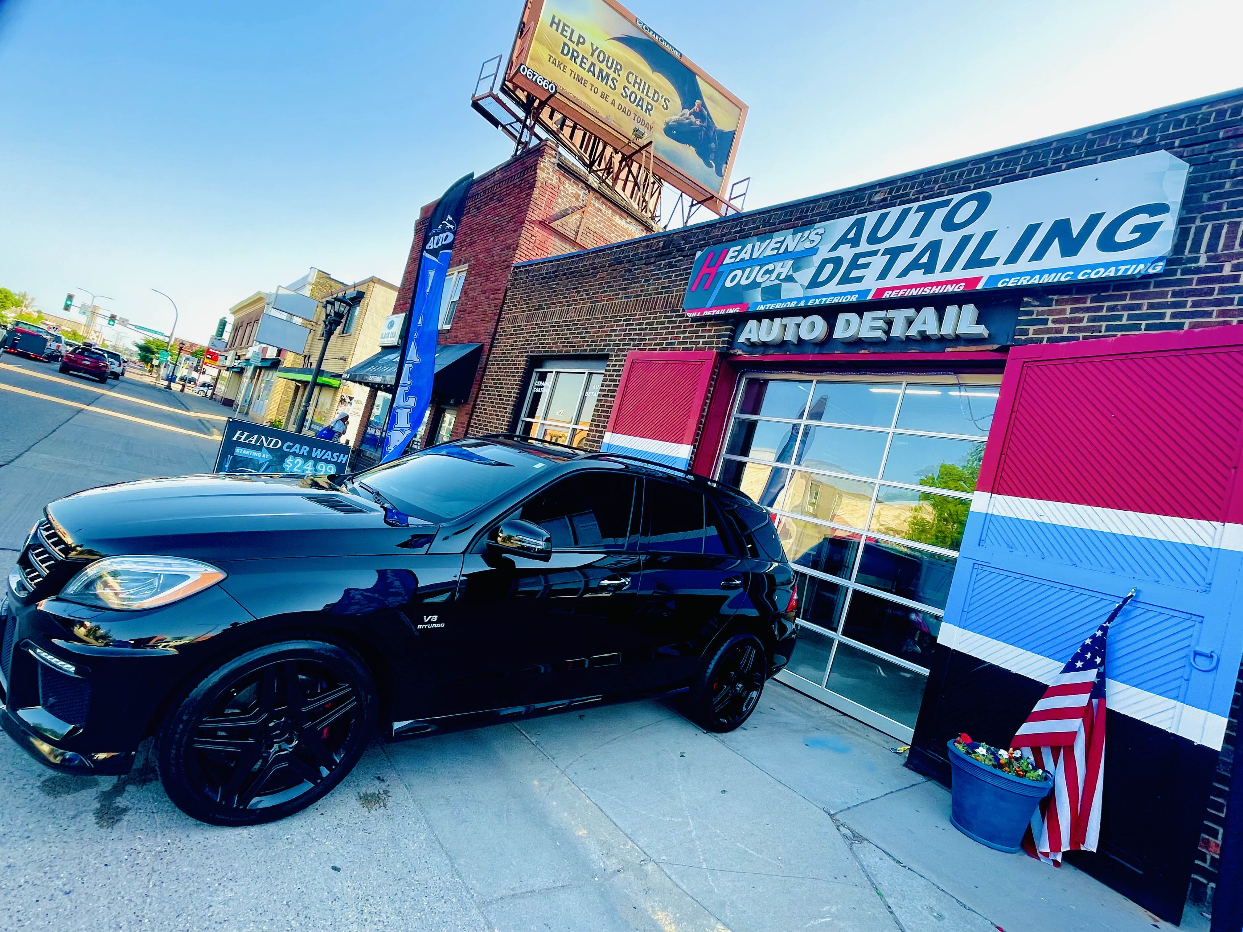Black SUV at Heaven's Touch Auto Detailing Storefront