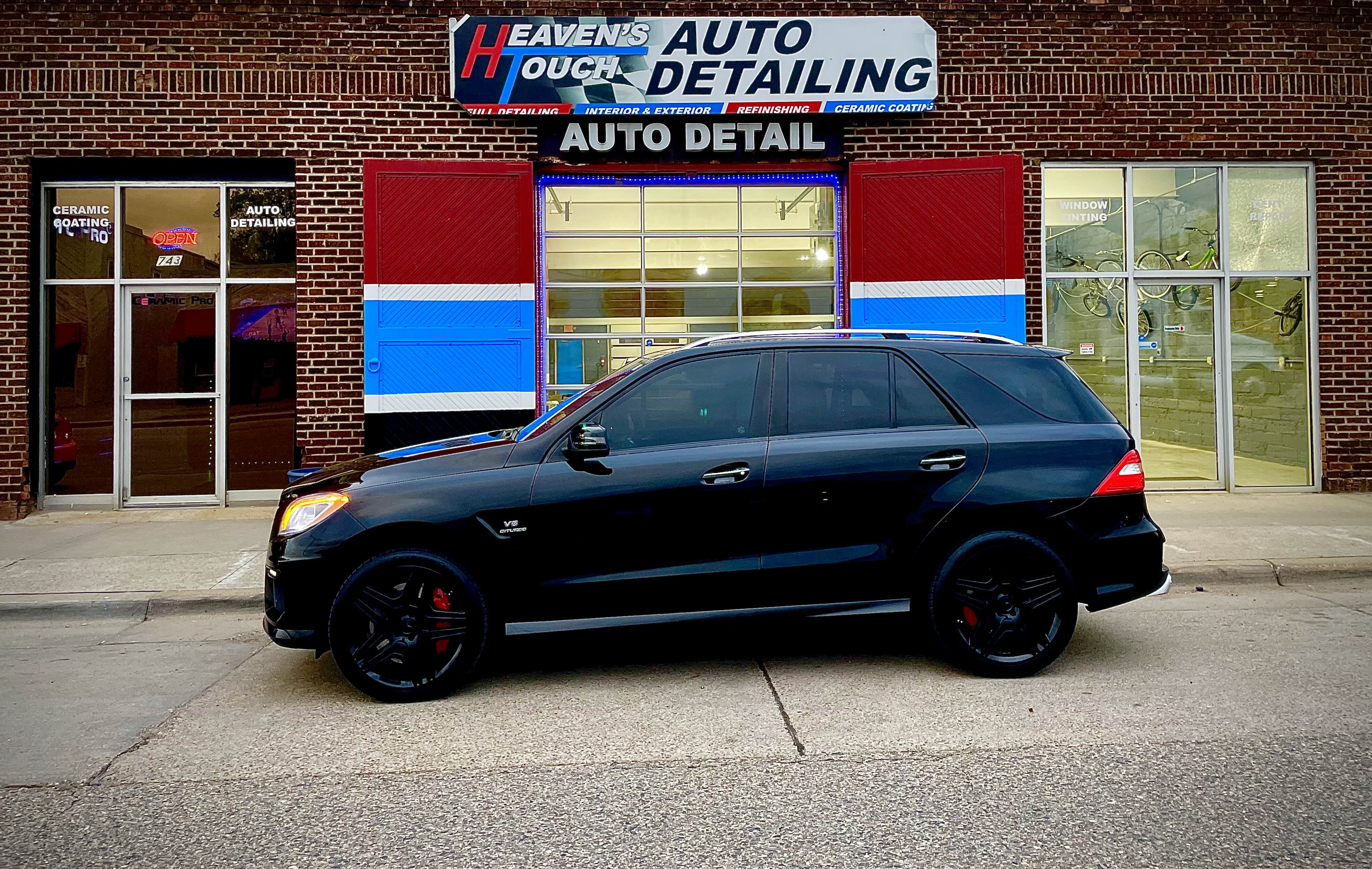 Luxury SUV at Heaven's Touch Storefront